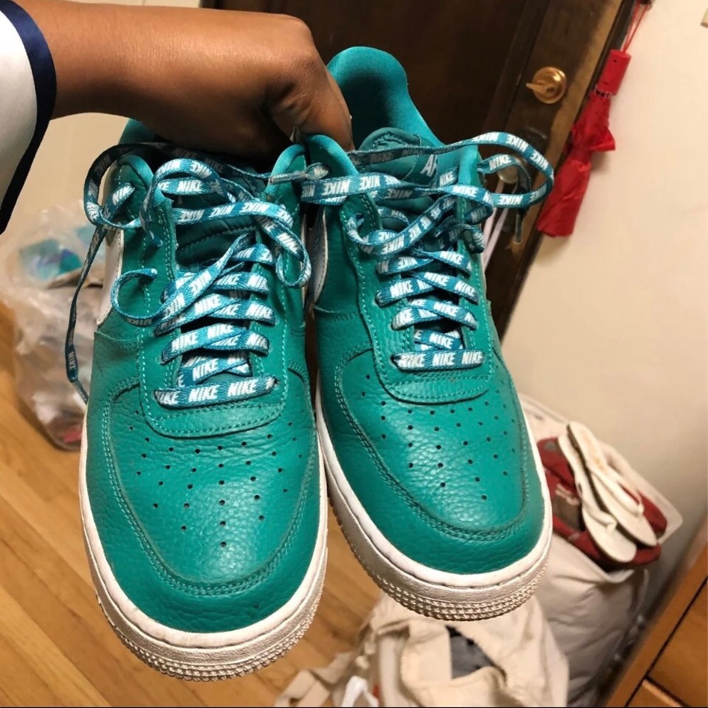 Teal colored Air Force 1. Worn maybe a year. Still very comfortable!